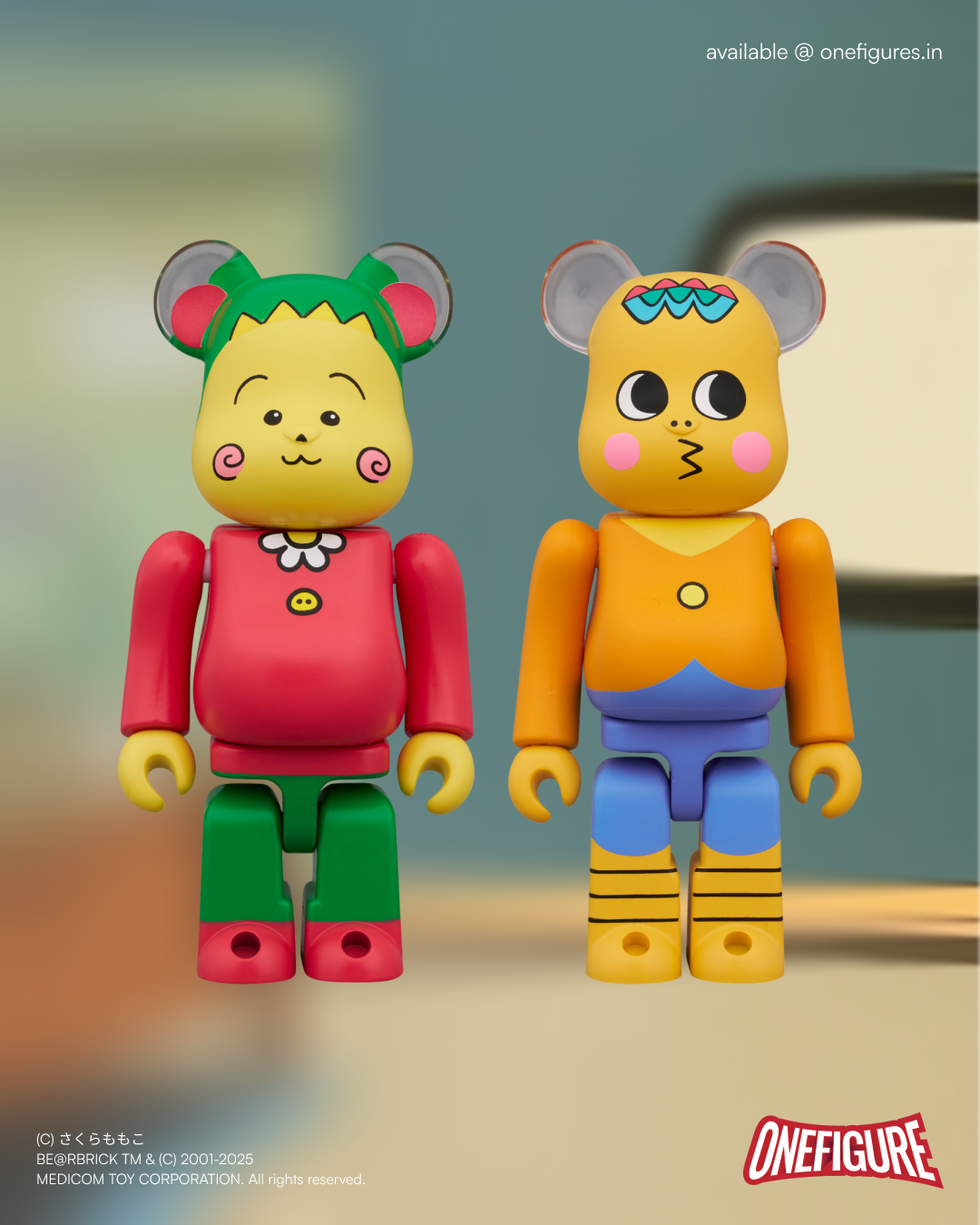 Two colourful bearbrick figures of Coji-Coji & Jiro with animal ears on a blurred background