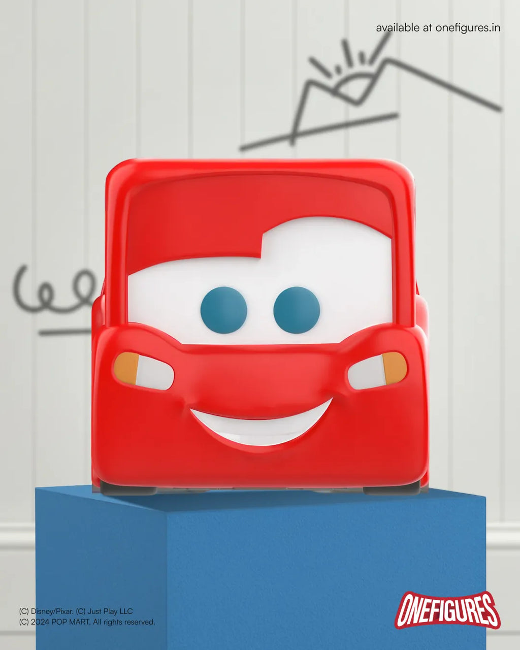 Lightning McQueen with a smiling face on a blue stand against a white background