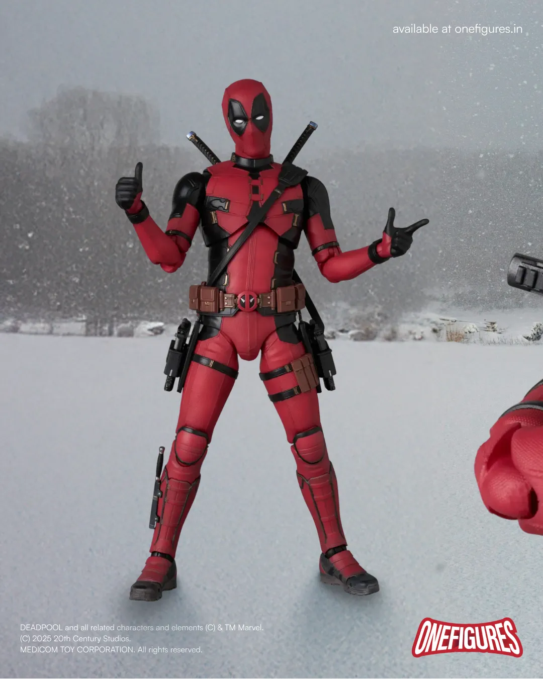 Deadpool action figure in a snowy landscape posing