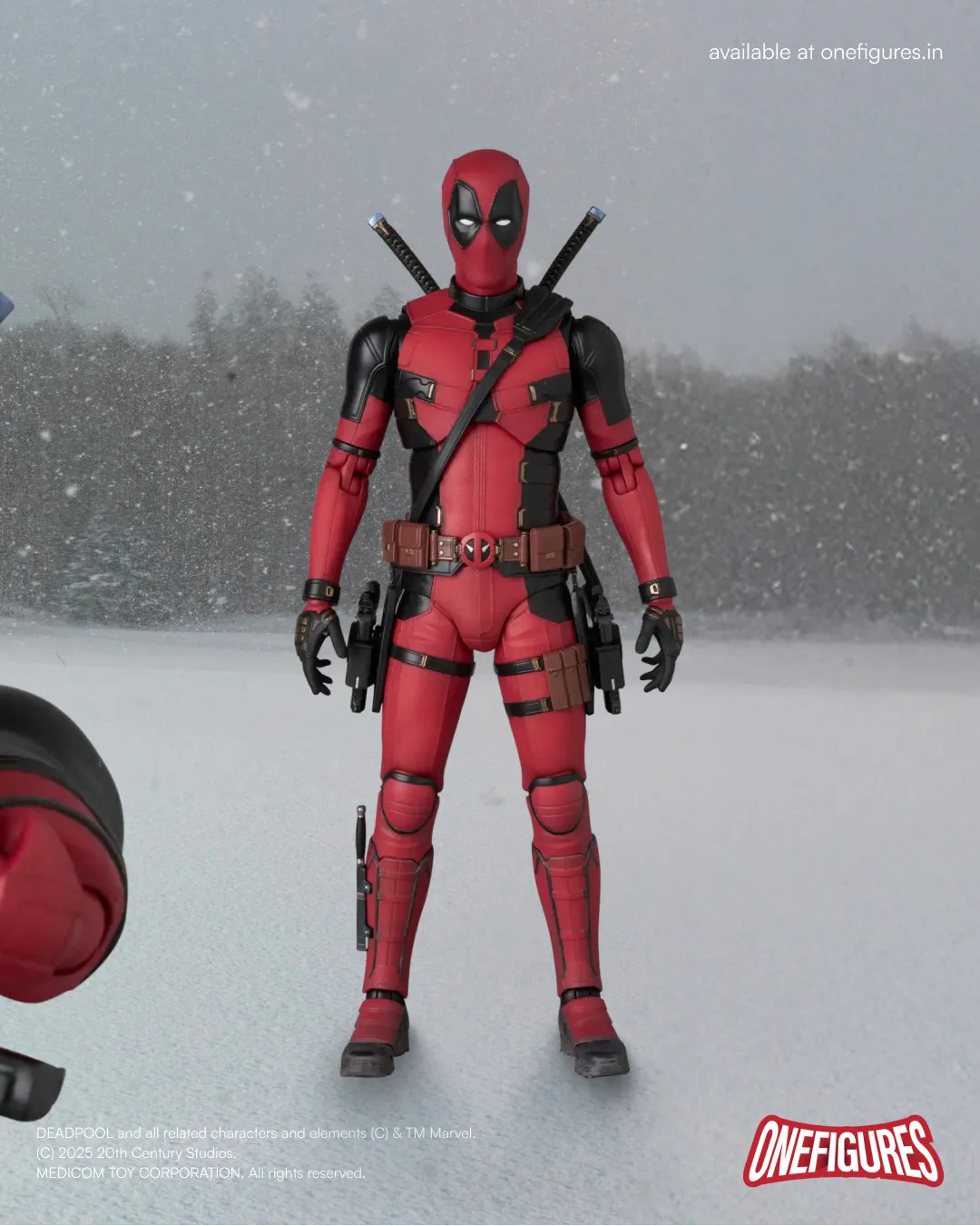 Deadpool action figure standing in snow in plane with 2 sword on back and 2 guns inside holster